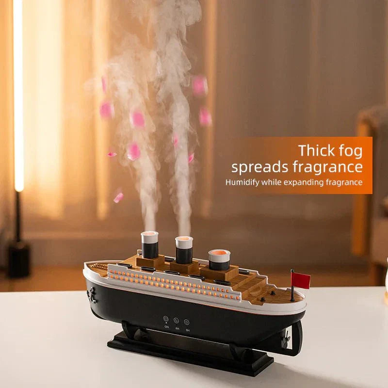 Essential Oil Diffuser with thick mist in a steamship design, featuring LED lights, on a table.