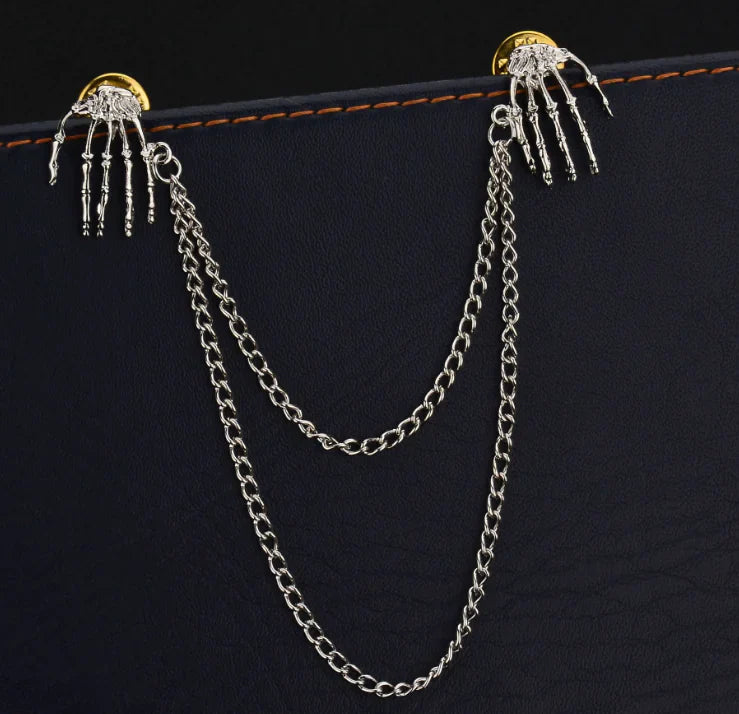 Bold Alloy Skull Claw Pin with Tassel, Electroplated Finish in Gold, Luxurious Statement Accessory.