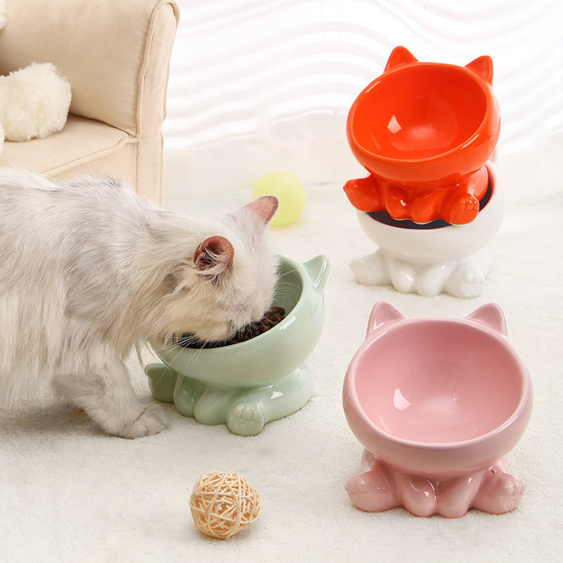 Ceramic cat bowl with neck guard in pastel colors, ideal for pet feeding.