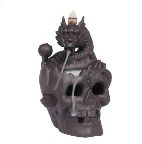 Skull Backflow Incense Burner with cascading smoke and LED light for gothic décor.