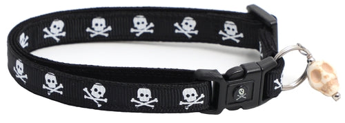Black cat collar with skulls and crossbones design, featuring breakaway clip and removable bell.