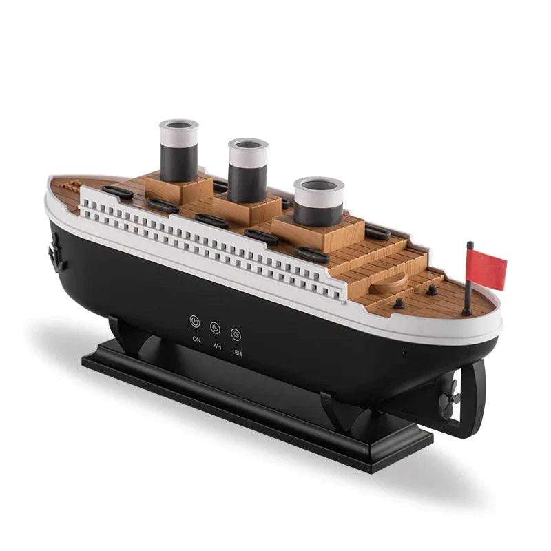 Essential Oil Diffuser with thick mist in a steamship design, featuring LED lights, on a table.