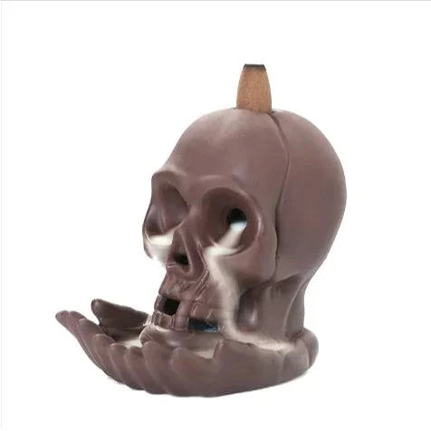 Skull Backflow Incense Burner with cascading smoke and LED light.