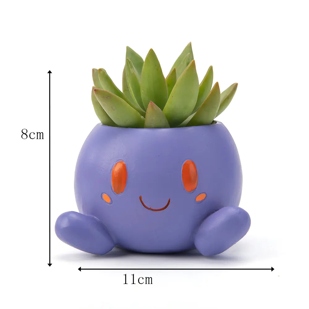 Purple Oddish Planter with succulent, measuring 8cm tall and 11cm wide.