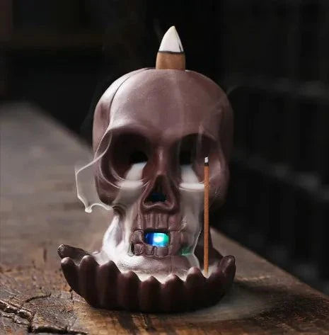 Skull Backflow Incense Burner with LED light and cascading smoke effect.