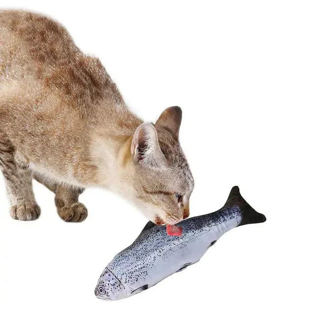 Cat playing with Creative Fish Shape Pet Toy filled with catnip, designed for durability and fun.