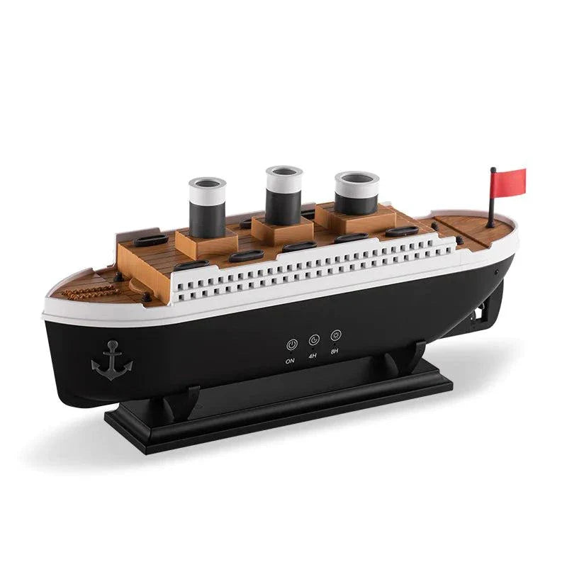 Essential Oil Diffuser with thick mist in a steamship design, featuring LED lights, on a table.
