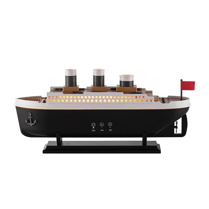 Essential Oil Diffuser with thick mist in a steamship design, featuring LED lights, on a table.
