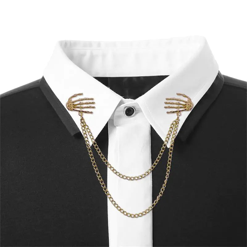 Bold Alloy Skull Claw Pin with Tassel, Electroplated Finish in Gold, Luxurious Statement Accessory.