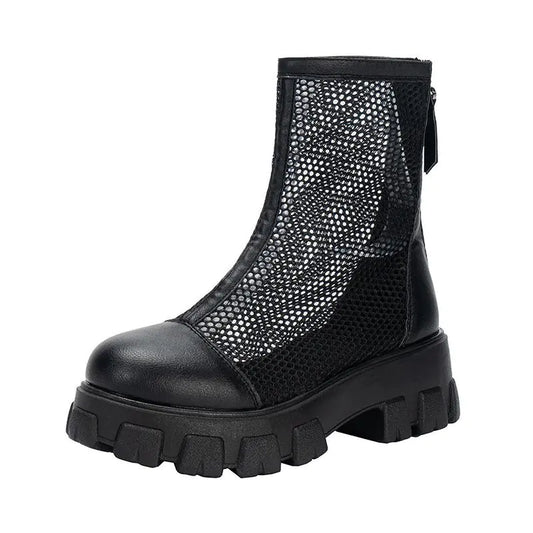 Ladies' zip-back fashion sandal in black, featuring a mesh design and chunky sole.