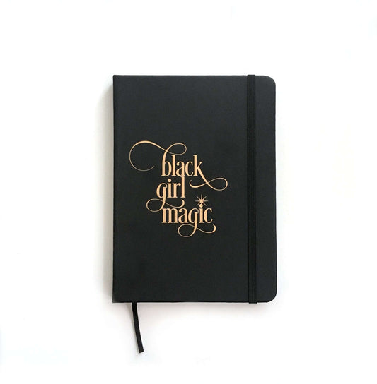 Black Girl Magic notebook with black PVC leather cover, gold lettering, elastic band, and ribbon bookmark, 5x8 inches, 80 lined pages
