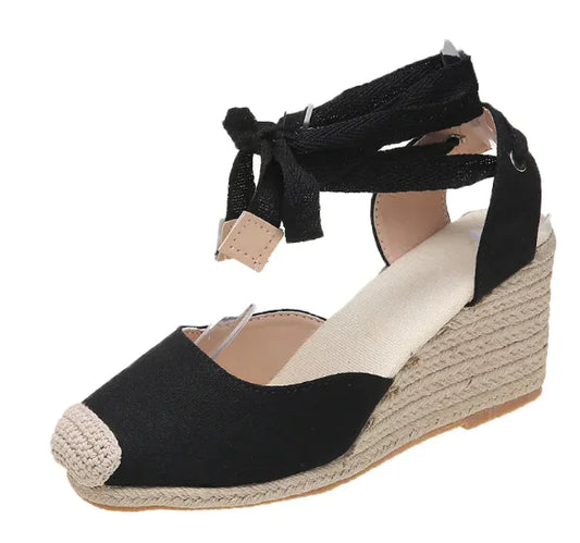 Black summer wedge strap sandal with toe cap and ankle tie closure