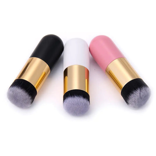 Flawless Finish Foundation Brush in black, white, and pink with gold handles and soft bristles.