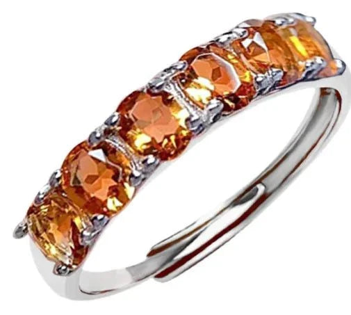 Personalized skull ring in white copper with orange zircon stones and unique skull design
