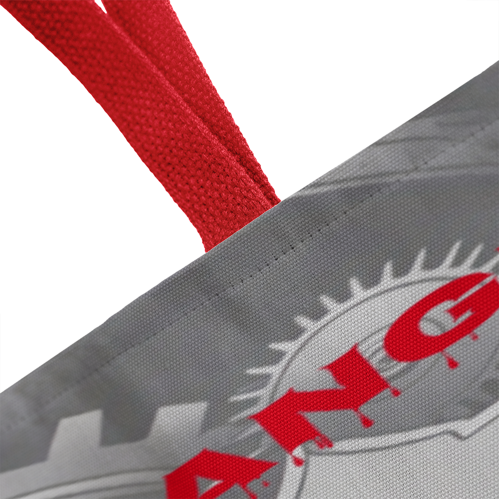 Strange & Unusual Tote Bag with red handles and unique design.
