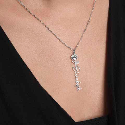 Custom Flower Name Necklace in silver with floral design and personalized cursive name pendant on an adjustable chain.