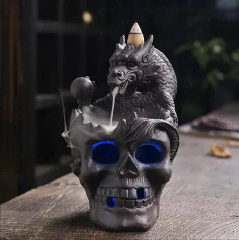 Skull backflow incense burner with cascading smoke and LED light for gothic décor.