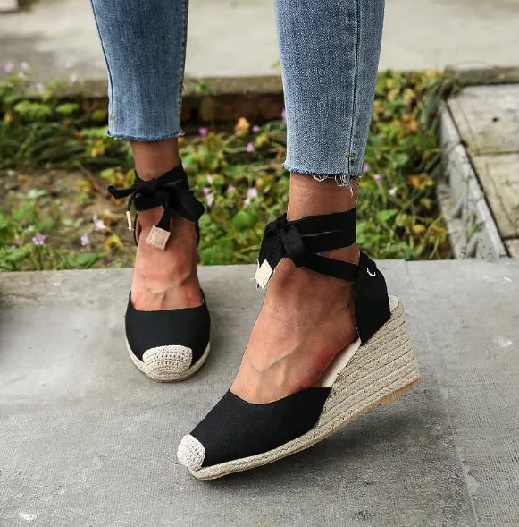 Summer wedge strap sandals with chic wedge heel and secure front and back straps, perfect for warm-weather outfits.