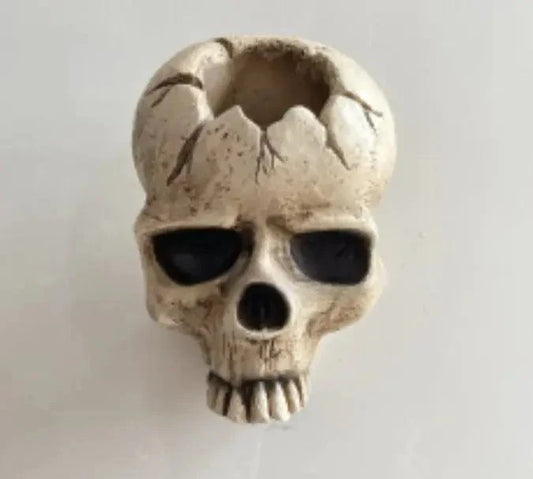 Skull wall candle holder decoration made of resin with a realistic skull design for hanging ornaments.